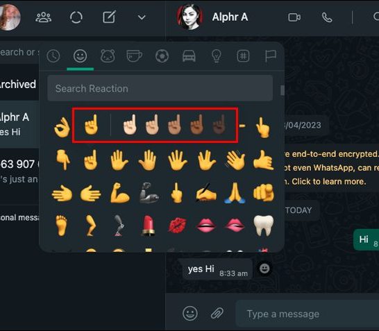 How do I put an emoji on a photo in Whatsapp