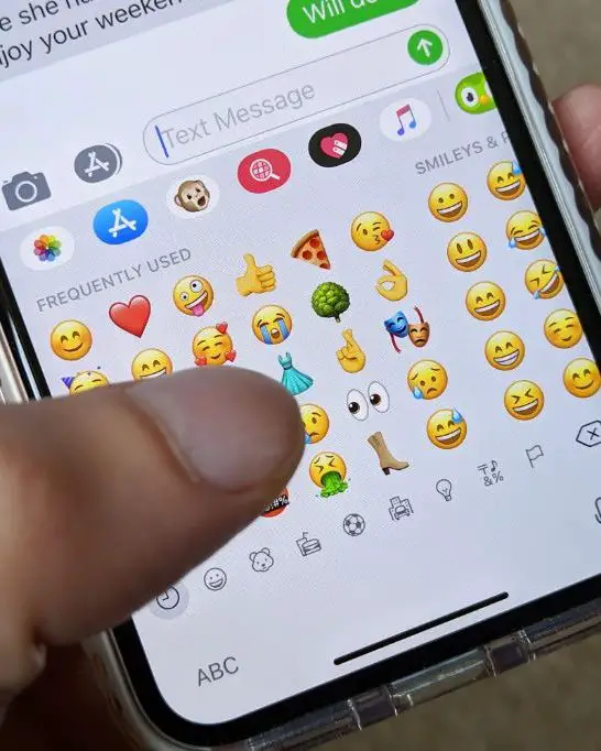 How do I make WhatsApp Emojis my default keyboard on iPhone