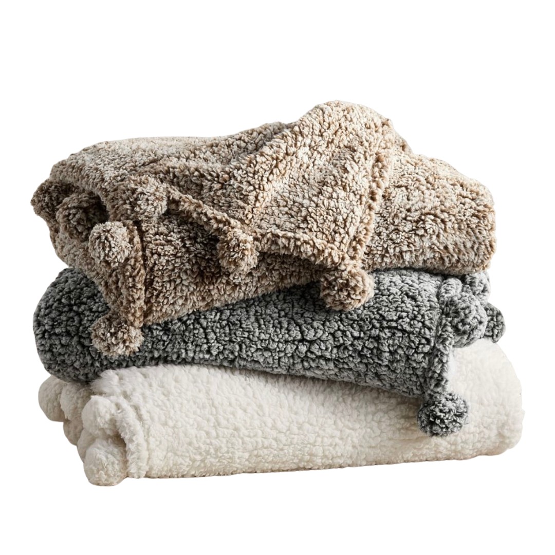 cozy pom pom sherpa throw blanket from pottery barn